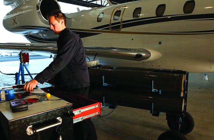 Engineer in hangar working on Citation X