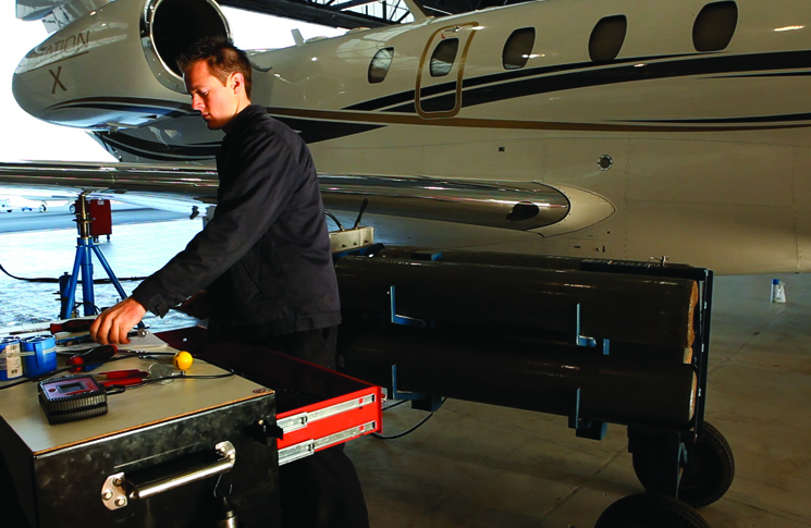 Engineer in hangar working on Citation X