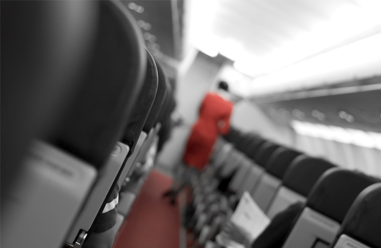 Cabin crew walking inside aircraft