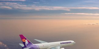 Hawaiian Airlines Boeing 767 flyying through a cloudy sky