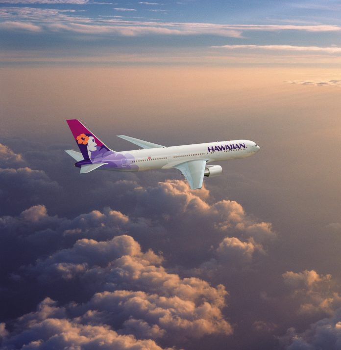 Hawaiian Airlines Boeing 767 flyying through a cloudy sky