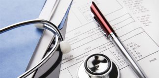 Medical records and stethoscope