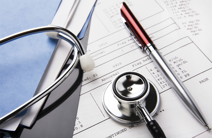 Medical records and stethoscope