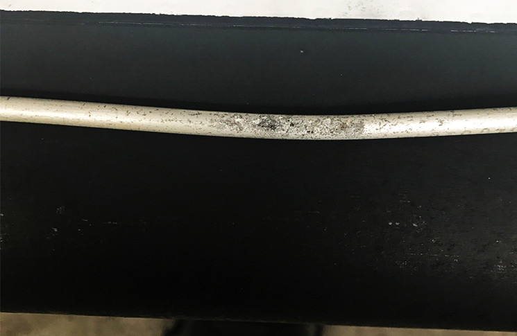 CESSNA 402 C - ATA 3240 LANDING GEAR BRAKE SYSTEM - LINE - Pin hole leak. Brake system unable to hold pressure on landing role. Defect was traced to pin hole leak in supply line. Line repaired.