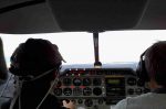 Pilot wearing a fNIRs headband while researchers on the ground monitor his cognitive workload