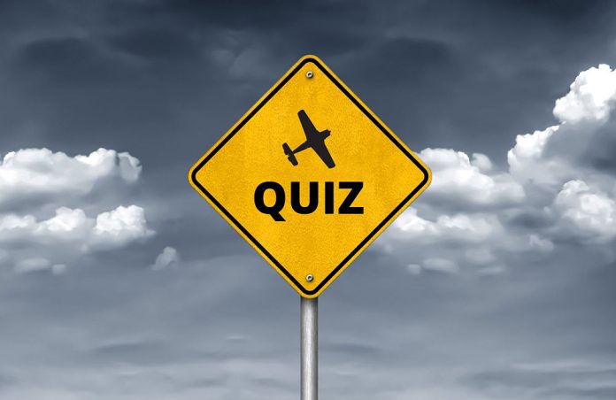 road sign with the word quiz
