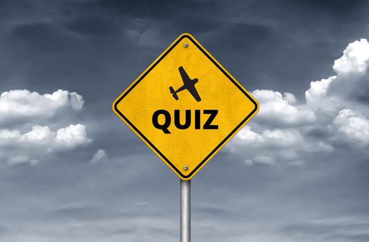 road sign with the word quiz