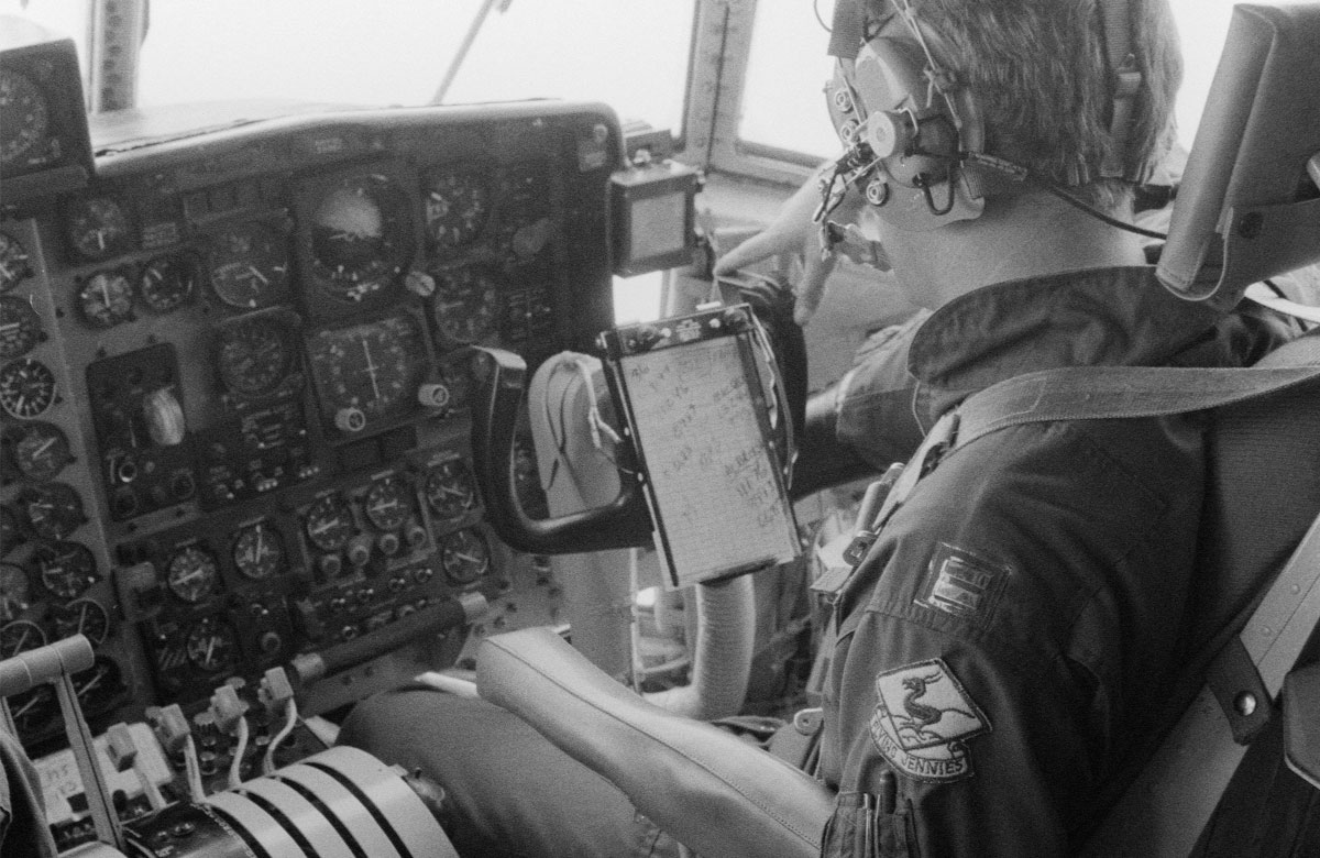 A copilot monitors instruments in the cockpit of a WC-130 Hercules aircraft of the 815th Weather Reconnaissance Squadron, 920th Weather Reconnaissance Group, during an investigation of Hurricane Allen.