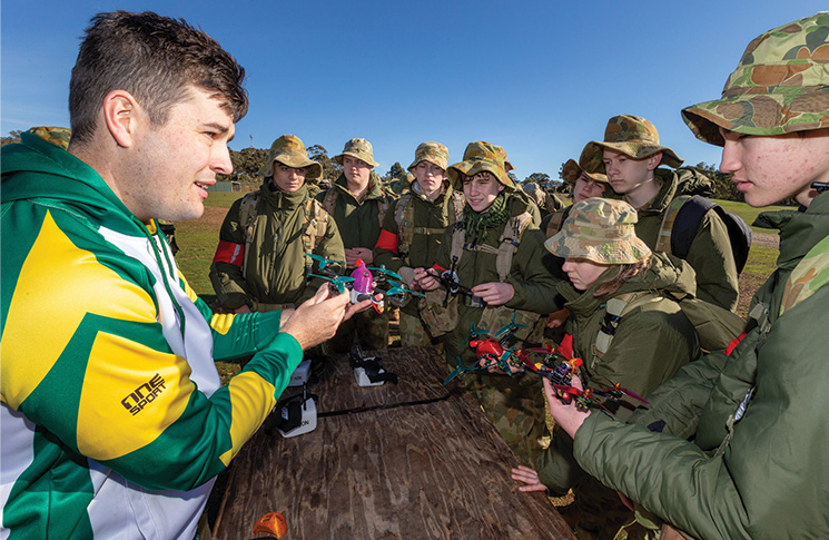 Australian Army soldier Private Mackenzie Togo demonstrates racing drones to Australian Army cadets during “Army on Display” exhibition at Puckapunyal Military Area, Victoria