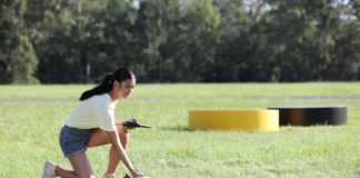 Woman preparing to fly a drone.