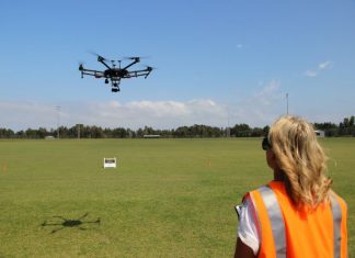 Jackie Dujmovic flying a drone