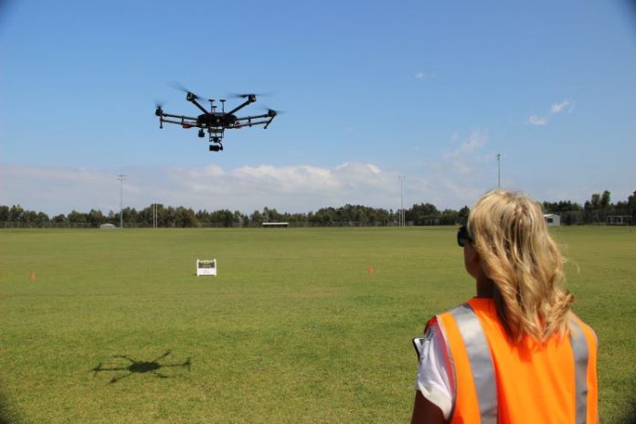 Jackie Dujmovic flying a drone