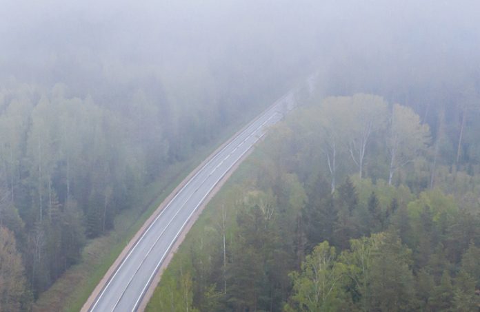 road obscured by low clouds