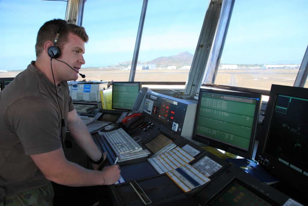A Royal Australian Air Force (RAAF) air traffic controller in Townsville air traffic control tower