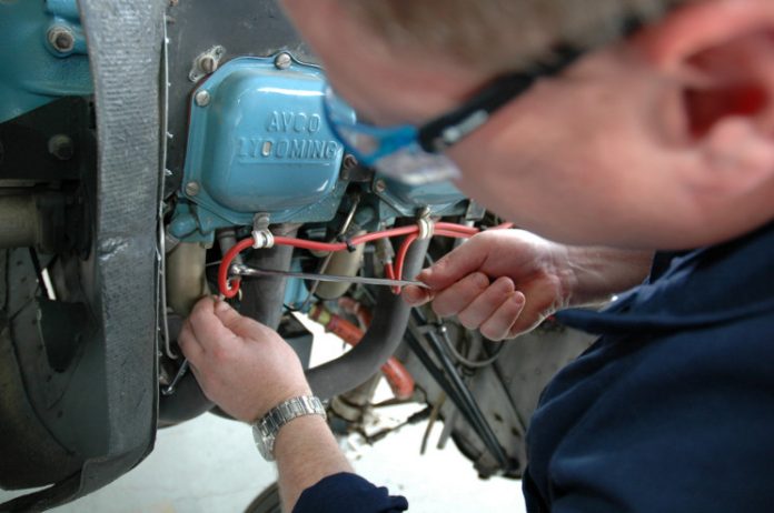 Engineer working on a Cessna 172M engine | Civil Aviation Safety Authority