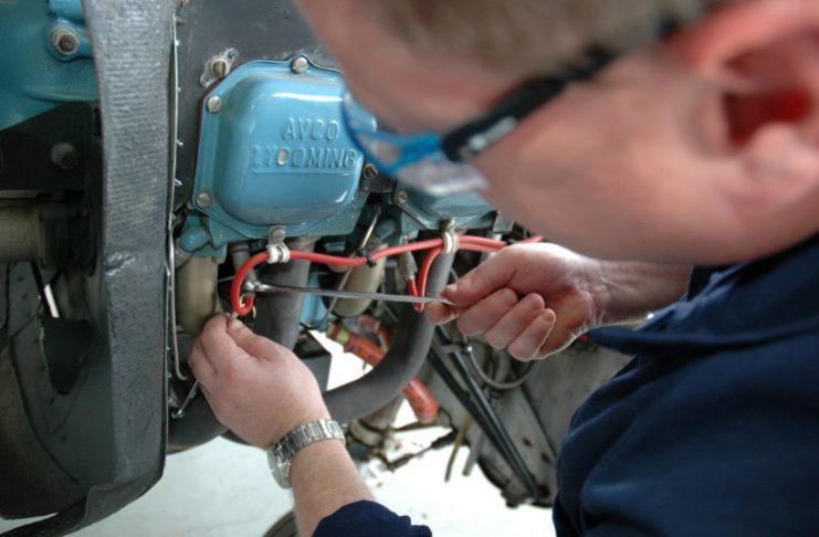 Engineer working on a Cessna 172M engine | Civil Aviation Safety Authority
