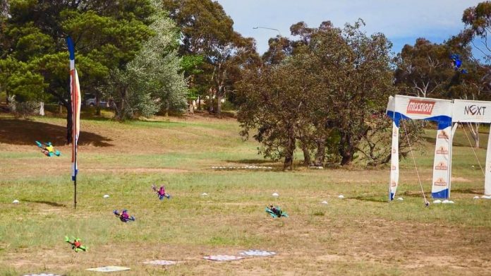 Racing drones taking off from the starting blocks at a Canberra Multirotor Racing Club race day.