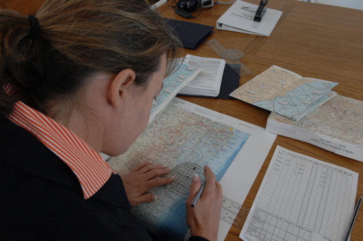 Pilot Salli-Ann Ward doing flight planning. image: © CASA