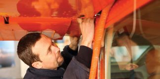 Engineer working on the wing of a Cessna