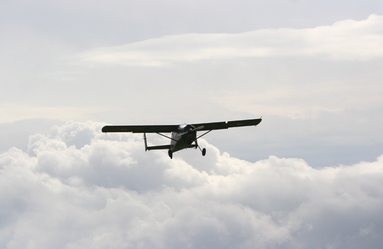 Plane flying through clouds