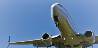 Close up of a section of a Boeing aircraft on a blue sky background