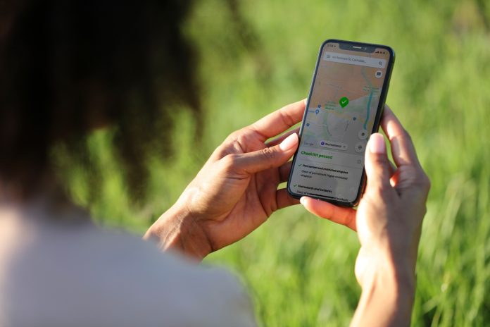 person looking at a drone safety app on their mobile phone