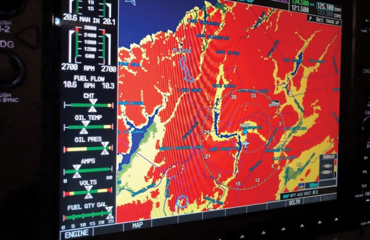 image: The G1000 multifunctional display moving map, showing a graphical presentation of the terrain-conflict-proximity function (not representative of the flightpath of the accident aircraft) | TAIC report