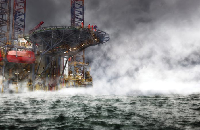 an offshore oil rig in cloudy conditions