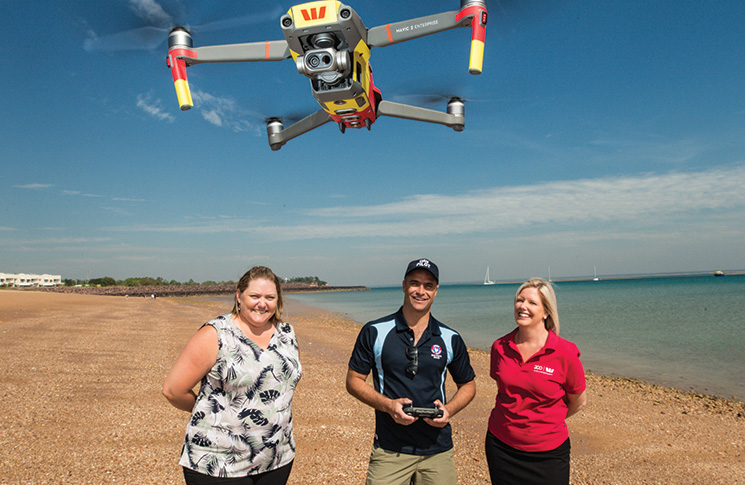 Left to right: SLSNT CEO Samantha Farrow, SLSNT Unmanned Aerial Vehicle Pilot Tom Caska, Westpac Regional General Manager Lisa Grundy.