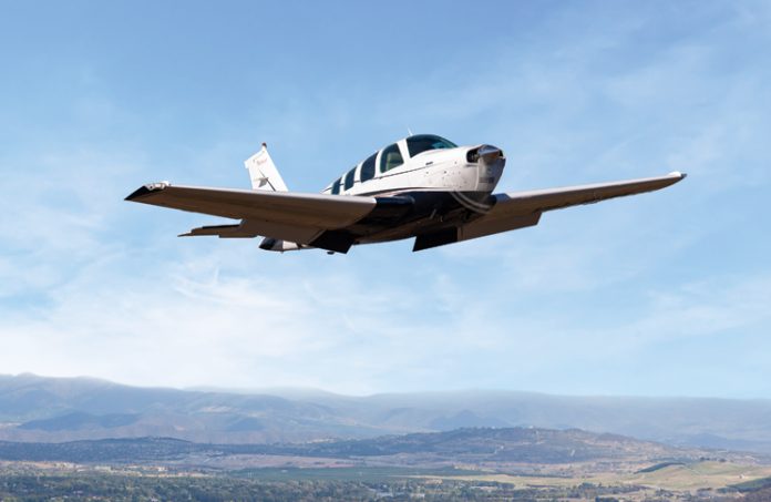 Aircraft flying over land in the sky