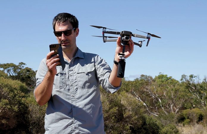 Tom Raimondo hand-launching a DJI Mavic 2 Pro with an attached Insta360 One X camera at Hallett Cove, South Australia. The 360 video footage was used to construct an immersive VR experience of this geological heritage site for teaching and community engagement, available at Project LIVE