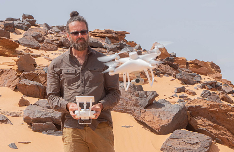 John Fardoulis using a small (RtK) mapping drone for creating cartography of minefields. Even though flights were programmed to take place automatically, manual take-offs and landings were required when it was windy. Terrain was uneven at the safe flying point next to the minefield, so extra care needed to be taken.