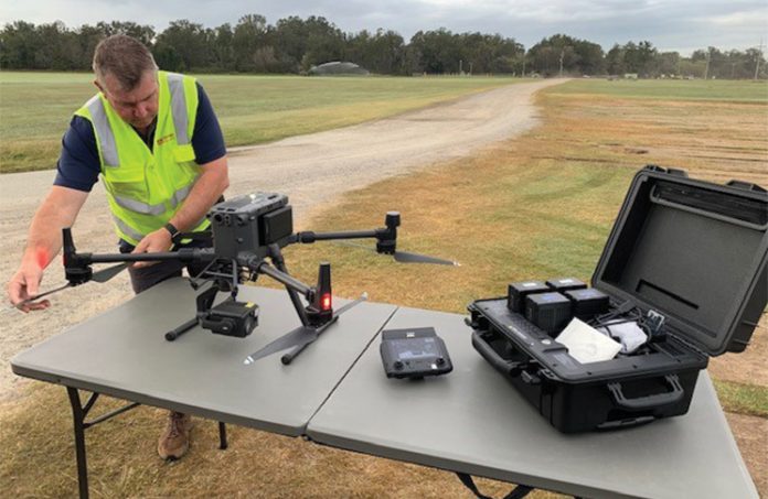 Wayne Condon conducting pre-flight checks for HQ Plantations, fire operations and intel gathering.