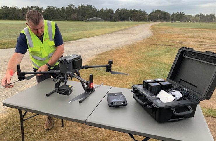 Wayne Condon conducting pre-flight checks for HQ Plantations, fire operations and intel gathering.