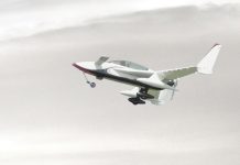 Aircraft flying is cloudy sky