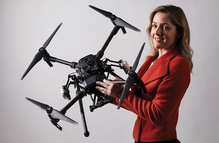 Woman holding a drone