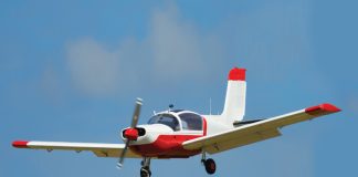 small aircraft flying in blue sky