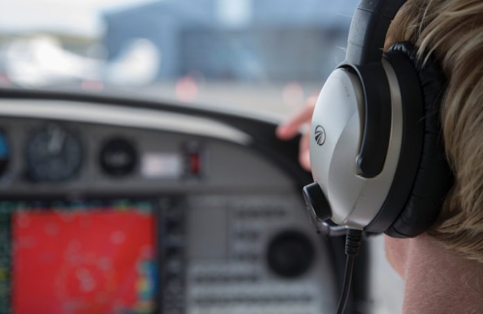 Pilot wearing headset.