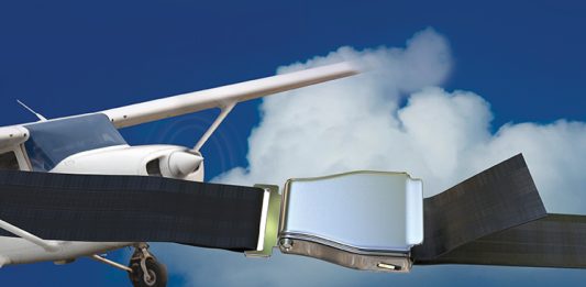 Abstract image of aircraft flying in the sky and a seatbelt