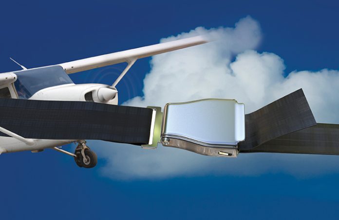 Abstract image of aircraft flying in the sky and a seatbelt