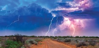 Summertime, daytime lightning storm over an outback road