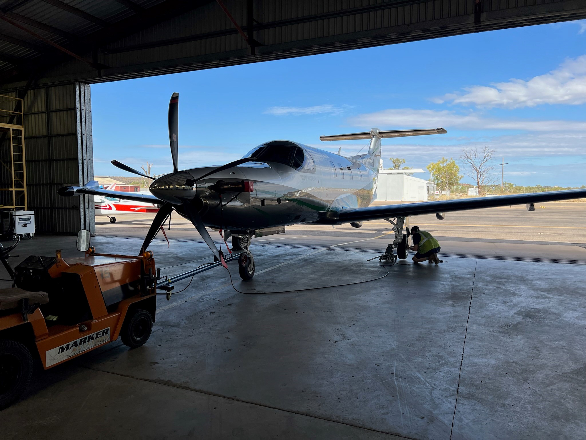 Luke checking the tyre pressure on a PC-12 NGX post field trip tyre change