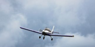 aircraft flying in a cloudy sky