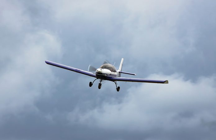 aircraft flying in a cloudy sky