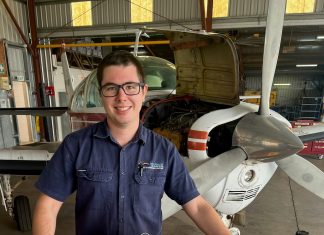 Luke getting ready to install an alternator on a A36 Bonanza