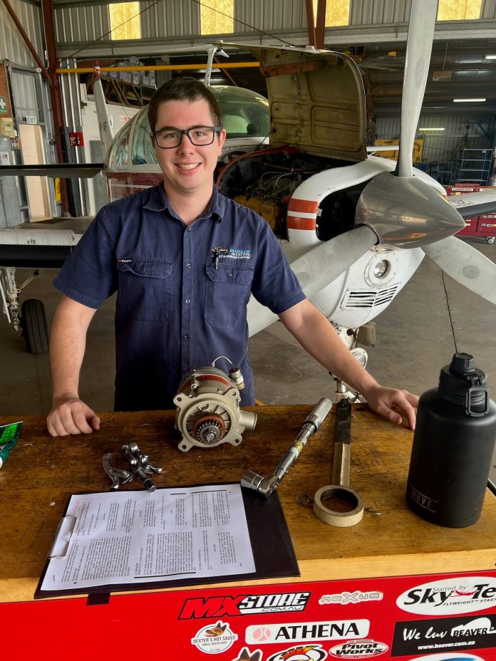 Luke getting ready to install an alternator on a A36 Bonanza