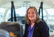 Portrait of Adrianne Fleming sitting inside a small aircraft