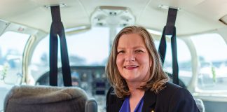 Portrait of Adrianne Fleming sitting inside a small aircraft