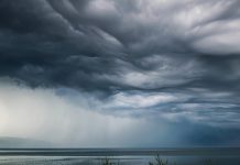 low clouds and rain above the ocean.