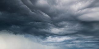 low clouds and rain above the ocean.